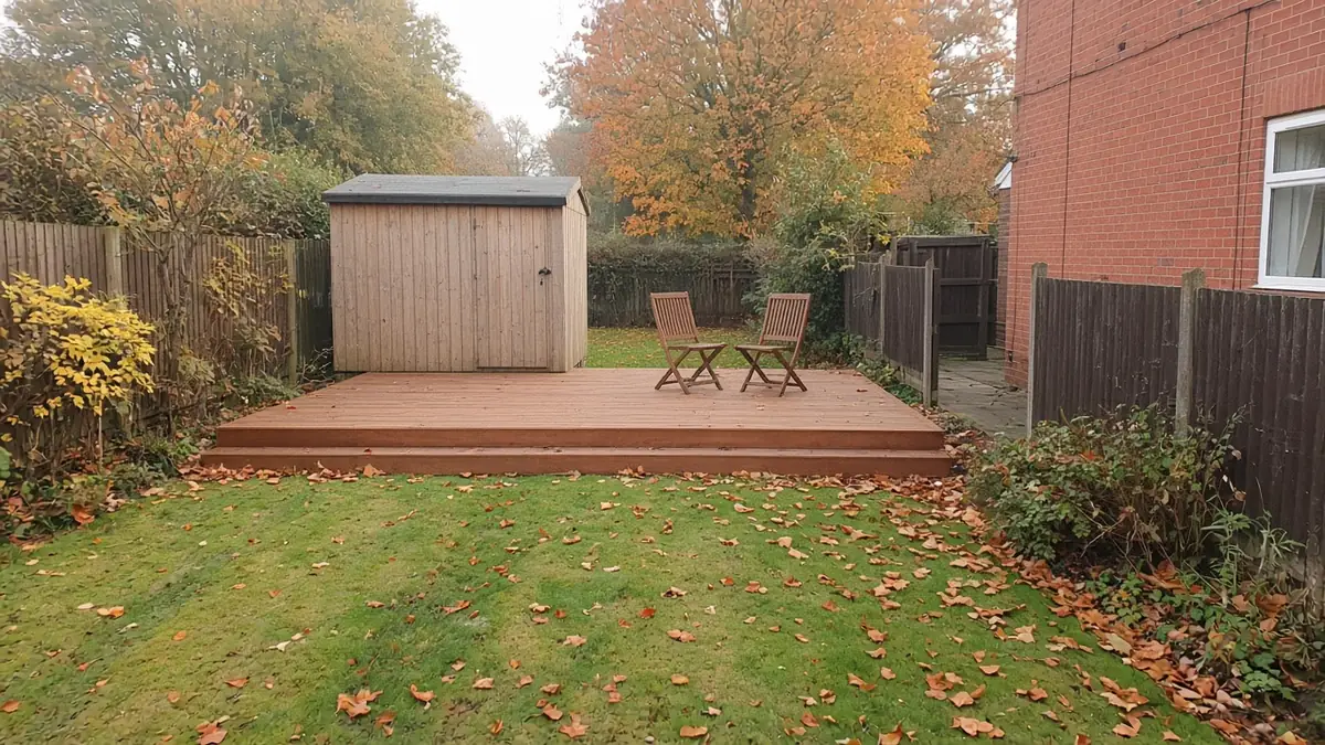 Example image: simple cedar-stained softwood deck at the bottom of a garden beside a shed